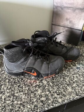 Nike Men's Black High-Top Athletic Shoes with Orange Swoosh